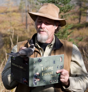 Picture of David Alexander Risk with Bird and-book - by Ben Curnaham